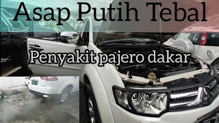 Mitsubishi pajero sport berasap putih