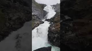 Kjosfossen waterfall Norway/ dancing lady in red/ Norway folk song dance/flam