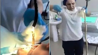 Horrifying moment doctors pull giant snake from woman's throat in Russia.