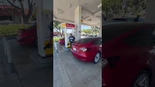 TESLA DRIVER ON A GOOD ONE !!! Caught trying to pump gas on electric car 🤦‍♂️ 🤦‍♂️