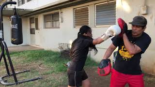 12 year old girl learning boxing from her dad.