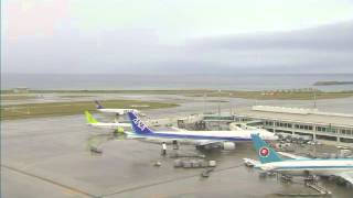 Naha Airport Japan webcam capture 2-Feb-14 - ANA 767 (retro colours), Solaseed, JAL