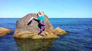 girl in tights swims in the sea