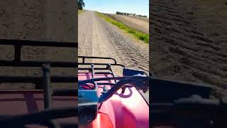 Riding the four wheeler to one of our farms