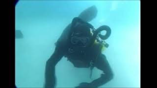 Female Divers are Diving with Neoprene Drysuit in Pool