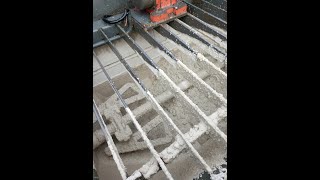 Visible white concrete tride C45/55. Filling from the mix into the pump