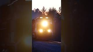 BNSF ET44C4 leads sand empties for CN with an incredible sunset background #shorts