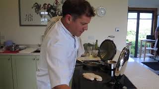 Matt Tebbutt sears monkfish on a cast iron hotplate