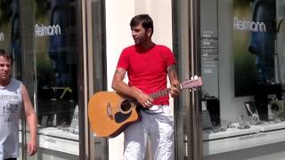 Slovakian musician performing Limp Bizkit`s" "Behind blue Eyes" on the street in Vienna