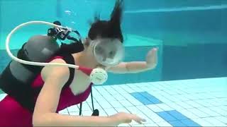 Female Diver is Diving with Swim Suit in Pool