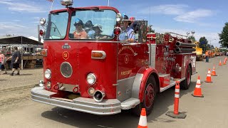 Famous fire engine from a classic 70s TV leads a parade of vintage unique vehicles.