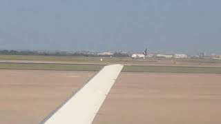 Busy terminal . Planes land as we prepare to take off. 1493