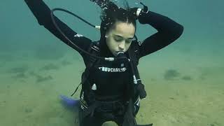 Female Diver is Diving with Beauchat Neoprene Wetsuit in Sea