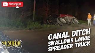 Canal Ditch Swallows Large Spreader Truck