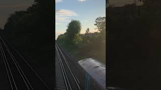 2 class 375s passing ham shades lane bridge with a single tone and a gorgeous sunset in the back