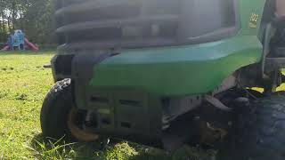 John Deere 102 Cutting Grass