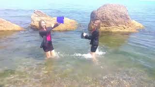 two girls in wet clothes