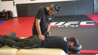 Theragun and rocktape for low back pain