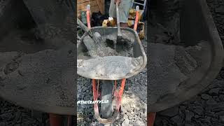 Cement Basics for Solar Panel Foundations - Crafty Lab Homestead concrete in a wheelbarrow