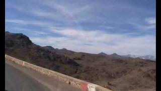 John Goldie driving on a cliff in Morocco