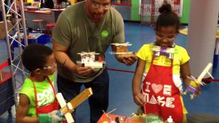 Family doing woodworking at Omaha Children's Museum's Maker-Space