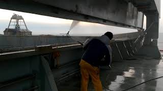 Professional hold washing by shore cleaning gang