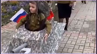 Russian children parade with Z tanks