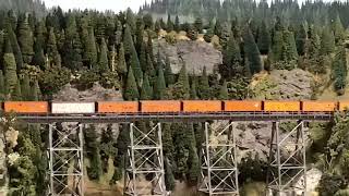 Ho Scale  train crossing a Trestle bridge.