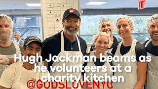 Hugh Jackman beams as he volunteers at a charity kitchen