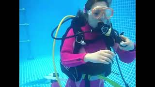 Female Diver is Diving with Neoprene Wetsuit in Pool