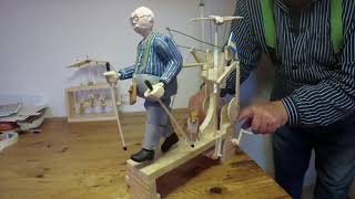 Automata. "The old man with walking sticks, dog and bird"