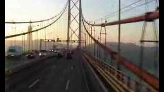 John Goldie driving over Lisbon suspension bridge