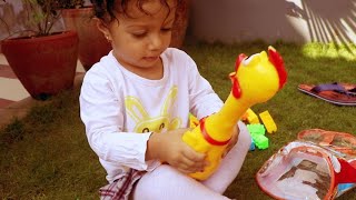 baby (Kushmi) playing colorful toy blocks