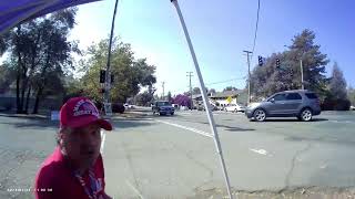 woman trying to destroy my signs with her car.