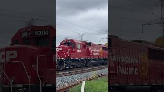 A Clean CP SD60-3 Trails Behind a Dirty AC44CW Duo on CPKC 137