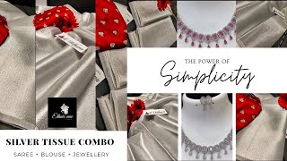 Silver tissue saree with red designer blouse material and silver finish jewellery set combo