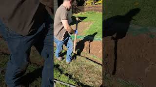 How to swing a pick axe.  Trenching like a fool.