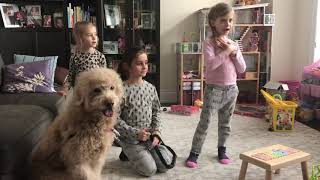 Kids teaching dog to bark