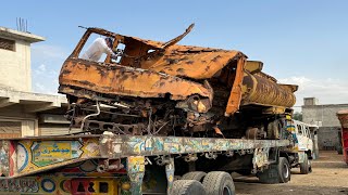 The water tank is rusted and completely destroyed due to years of lying in the open field. Let's see