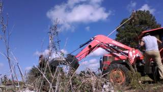 Kubota m9000 front end loader grapple railroad ties