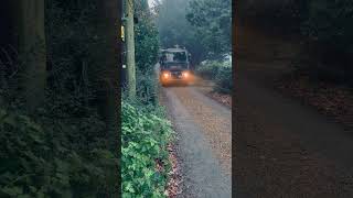 Renault truck driving down single track lane