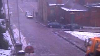 Car slides down icy street hitting owner and 3 other cars in Rochdale