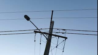 Free 4K Royalty-Free Stock Video: Power lines silhouette against blue sky