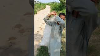 A small boy in Village working hard for his family.