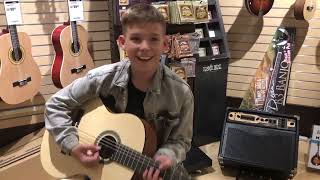 Shopping for a guitar at the Sam Ash music store in New York City