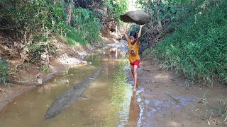 Two girls are very happy when they catch a big fish to cook