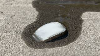 Ice cube melting in hot weather time-lapse