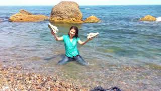 girl in denim jacket and jeans gets wet