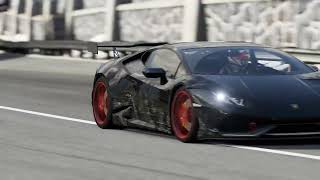 fast black car goes around the racetrack part 2