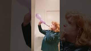 purple curly balloon blow